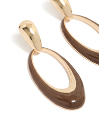 Featuring statement oval drop earrings with brown enamel in gold close up view - link has visual effect only