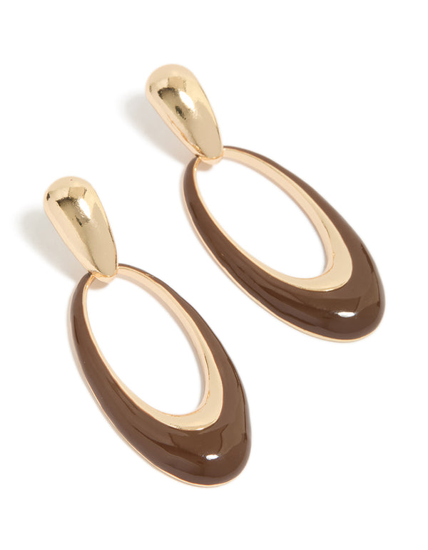Showcasing statement oval drop earrings with brown enamel in gold front view