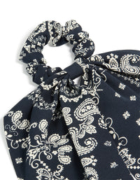This paisley printed scarf scrunchie comes in black and ivory with statement design side view - link has visual effect only