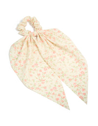 Showcasing a pretty pink flower printed scarf scrunchie featuring leaf and floral pattern in cornsilk, light pink, and pale green front view - link has visual effect only