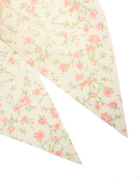 Designed with pretty pink flower printed scarf scrunchie featuring leaf and floral pattern in cornsilk, light pink, and pale green detail view - link has visual effect only