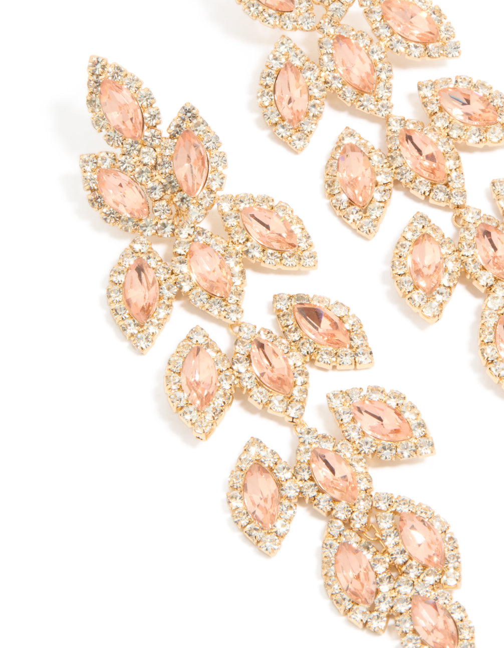 Stunning gold diamante gleaming pear drop earrings with peachpuff stones close up view