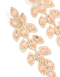 Stunning gold diamante gleaming pear drop earrings with peachpuff stones close up view - link has visual effect only