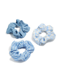 Showcasing a set of floral checkered fabric scrunchies in a 3-pack featuring light sky blue white and light blue accessories front view - link has visual effect only