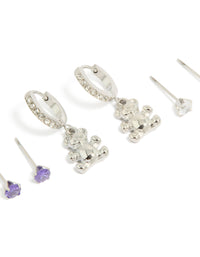 Discover this stainless steel bear earrings 3-pack with cubic zirconia crystals featuring waterproof huggie and stud closures in silver, blueviolet, and white close up view - link has visual effect only