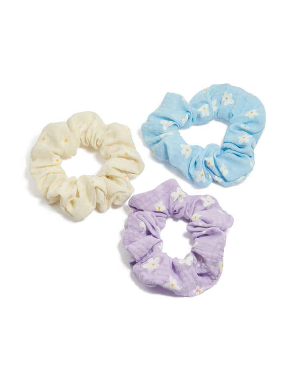 Showcasing tweens pastel scattered flower scrunchies in a 3-pack featuring floral print with lavender sky blue beige and gold front view