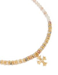 Showcasing a gold plated semi precious stones beaded cross necklace close up view - link has visual effect only
