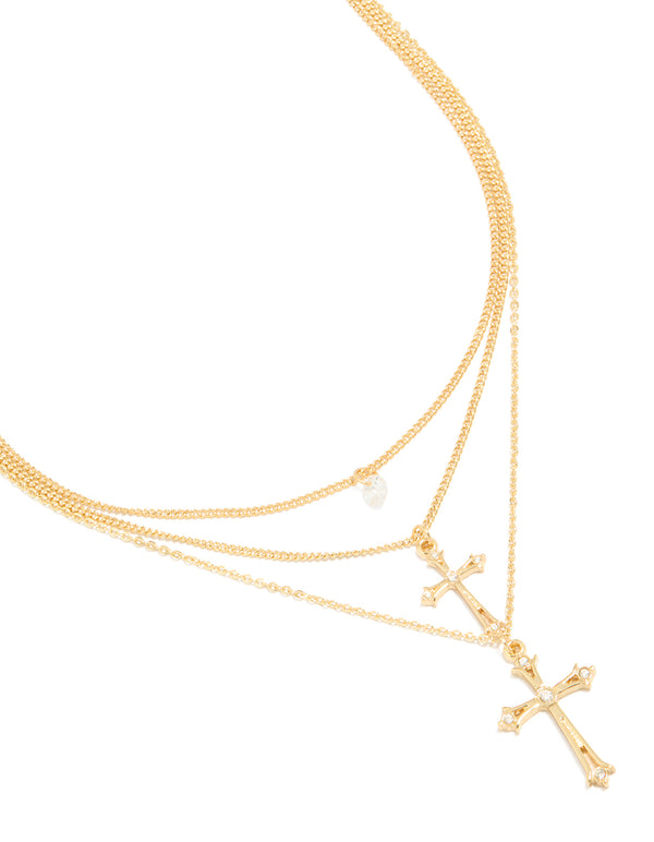 Discover this gold plated cubic zirconia and cross charms layered necklace featuring crystal pearl details close up view