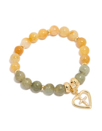 Showcasing a gold plated beaded bracelet with cross and heart in cubic zirconia, chunky statement design front view - link has visual effect only