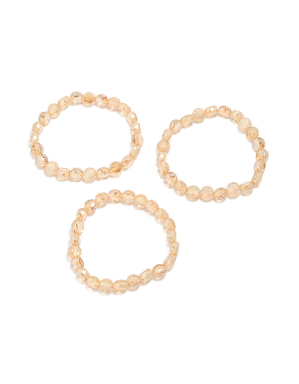 Showcasing amber beaded stretch bracelets in a 3-pack with wheat and burlywood tones front view