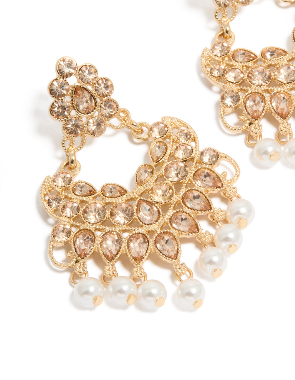 Crafted statement drop earrings featuring with charm and pearl in gold close up view