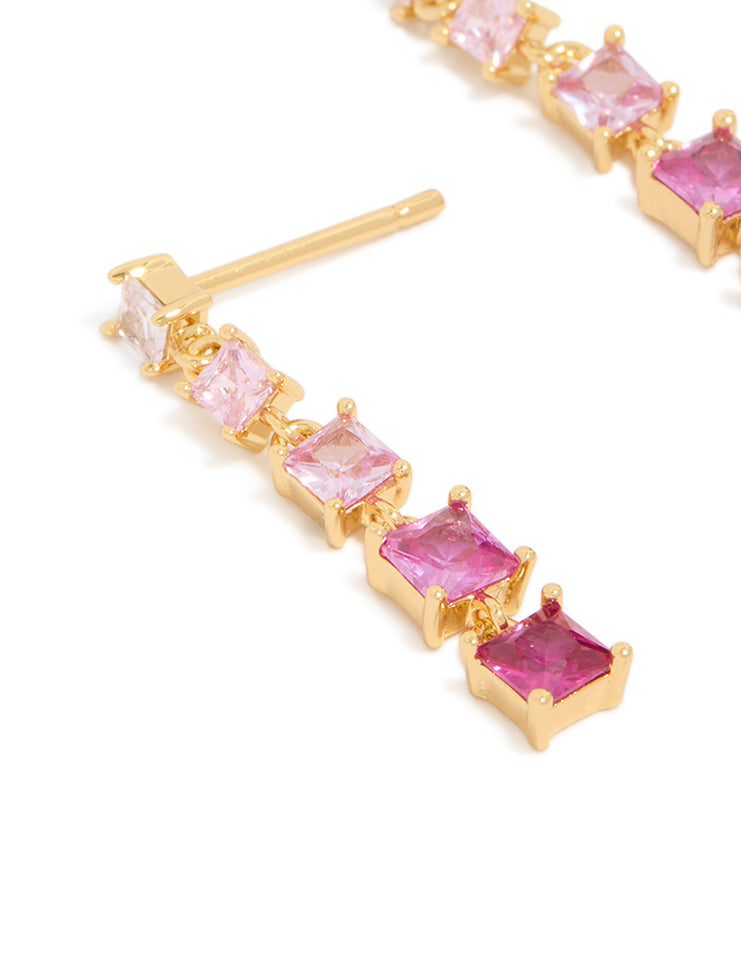 Designed with cubic zirconia in gold featuring hot pink and light pink gradient statement drop earrings close up view