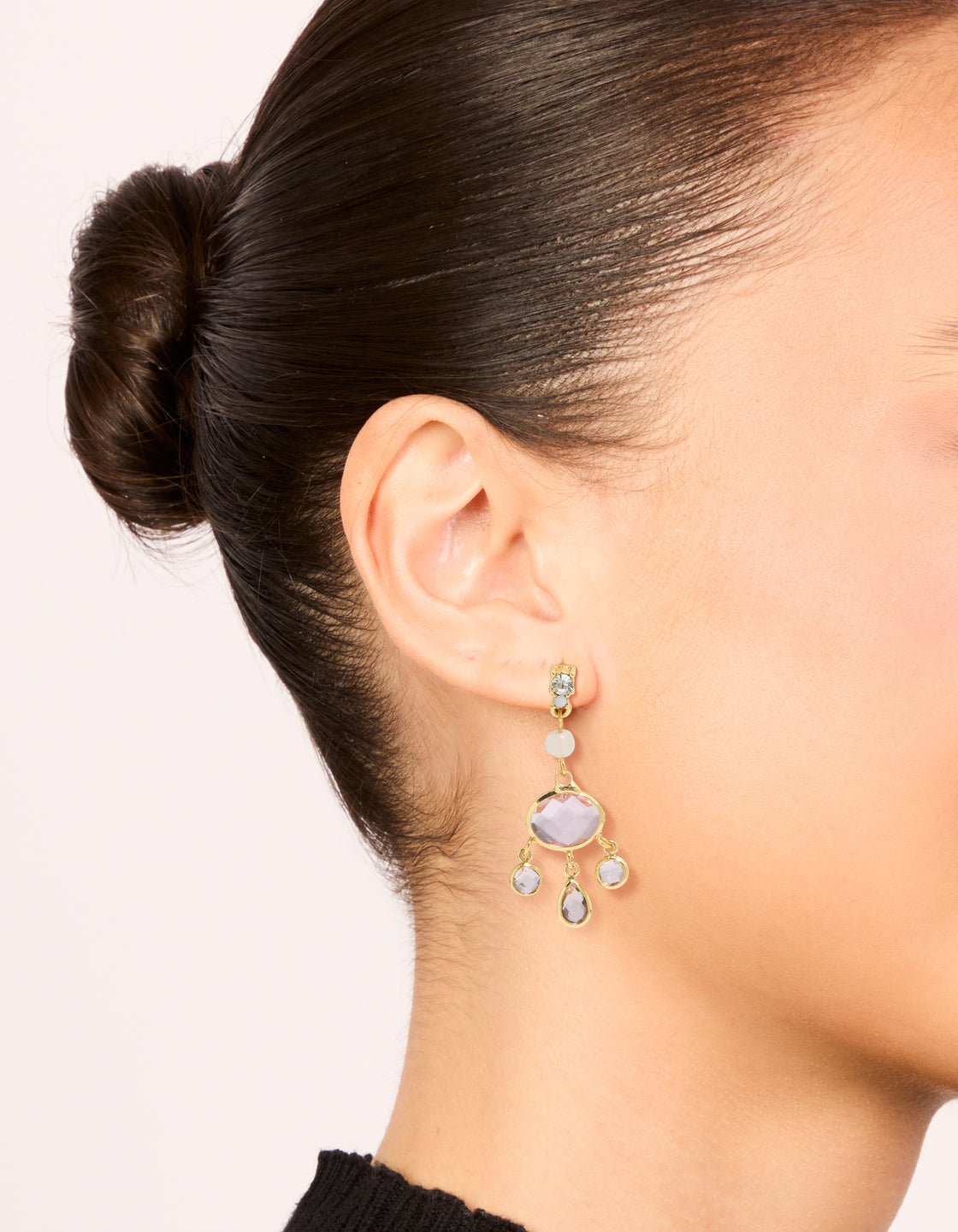 Featuring gold plated clear bead and diamante drop earrings with charm details on ear view