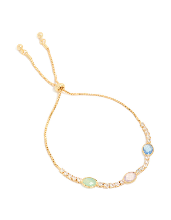 Beautifully crafted bezel toggle bracelet with cubic zirconia in blue, pink and green tones, plated gold finish front view