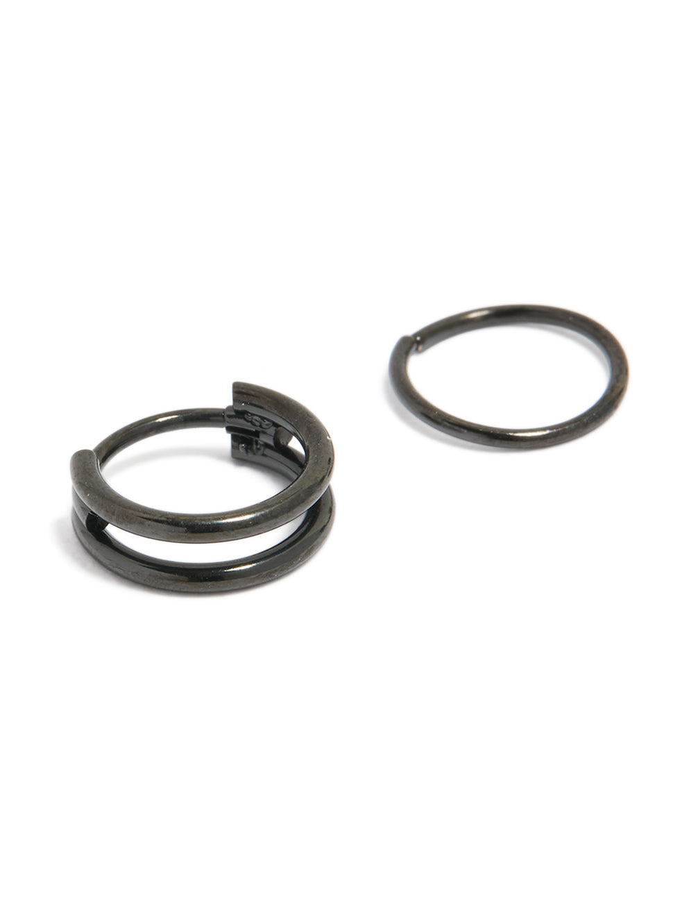 Showcasing black coated surgical steel double hinged and plain nose rings in chunky style detail view
