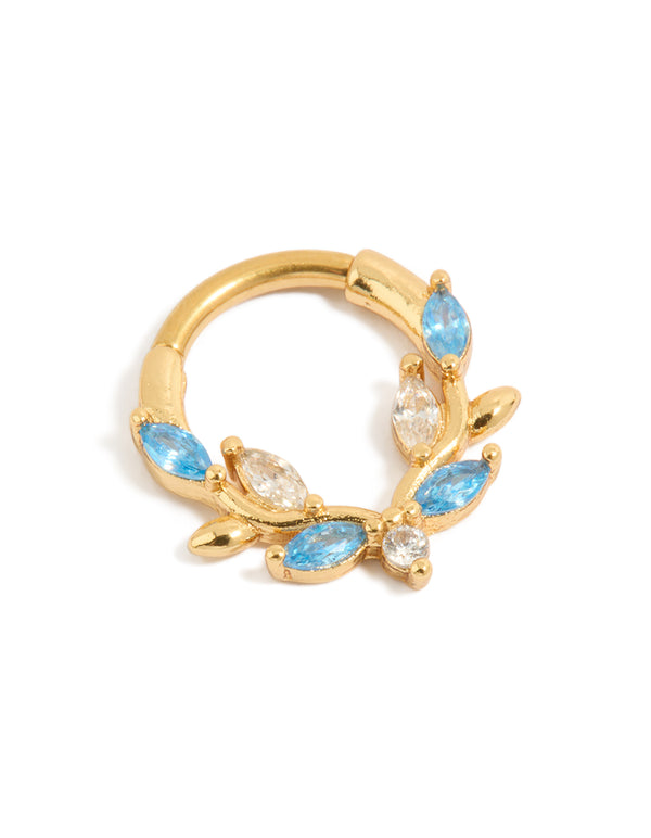 Showcasing a gold plated titanium clicker ring with blue and clear cubic zirconia stones front view