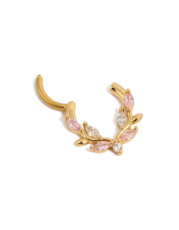 Showcasing a stunning clicker ring in gold plated titanium adorned with pink and clear cubic zirconia in statement detail view