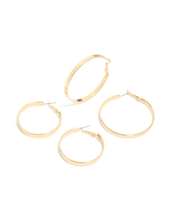 Featuring wide flat hoop earrings in a 2-pack, crafted from gold plated material with statement styling and hoop closure front view