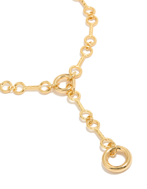 Showcasing a gold plated multi organic circle Y-necklace close up view