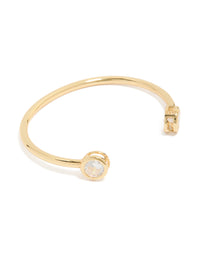 Showcasing a gold plated cubic zirconia open wrist cuff in clear front view - link has visual effect only
