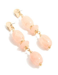 Statement drop earrings featuring oval cut pink beads with gold accents front view - link has visual effect only