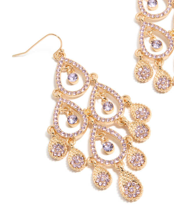 Crafted from gold featuring purple diamante open drop earrings with charm details in a statement style close up view