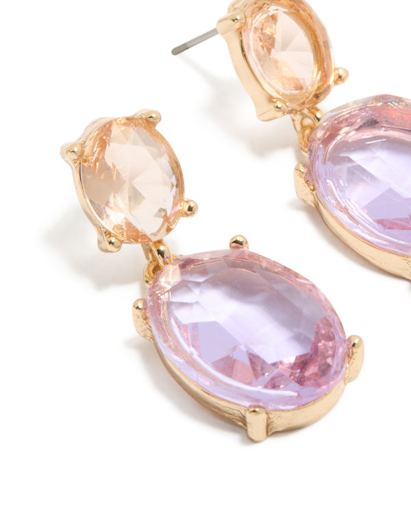 Showcasing statement double drop earrings in gold with purple and orange diamantes close up view