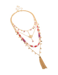 Showcasing gold purple and pink beaded tassel layered necklace with charm disc pendant in statement style front view - link has visual effect only