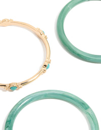 Discover this gold and blue acrylic bangles 4-pack with beads in turquoise and aqua close up view - link has visual effect only