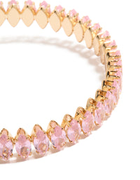 Featuring a gold pink diamante bracelet with light pink stones close up view - link has visual effect only