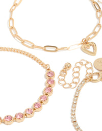 Explore the fine details of gold diamantes and heart charm bracelet 4-pack with beads in light pink, powder blue, and clear stone close up view - link has visual effect only