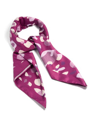 Showcasing a berry pink fabric scarf scrunchie with leopard print in maroon, light pink, medium orchid, and bisque tones detail view - link has visual effect only