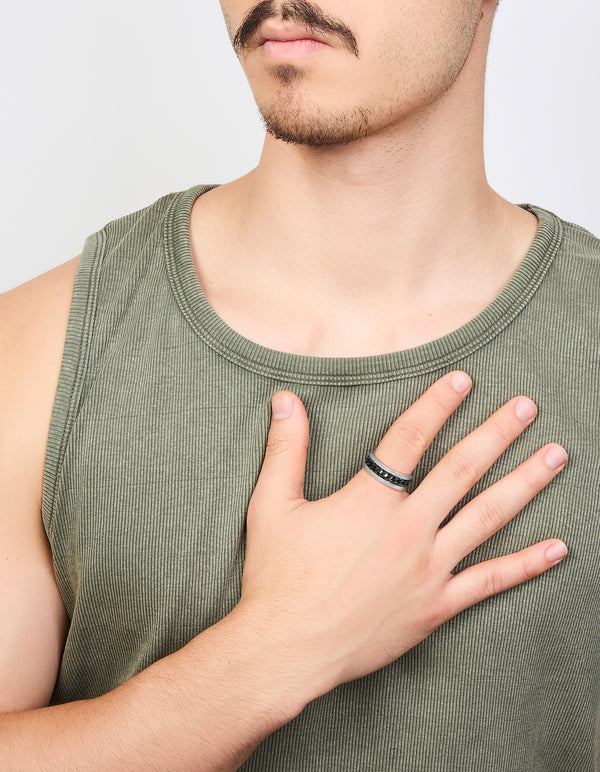 Featuring a mens waterproof stainless steel band ring with black chain detail in silver on finger view