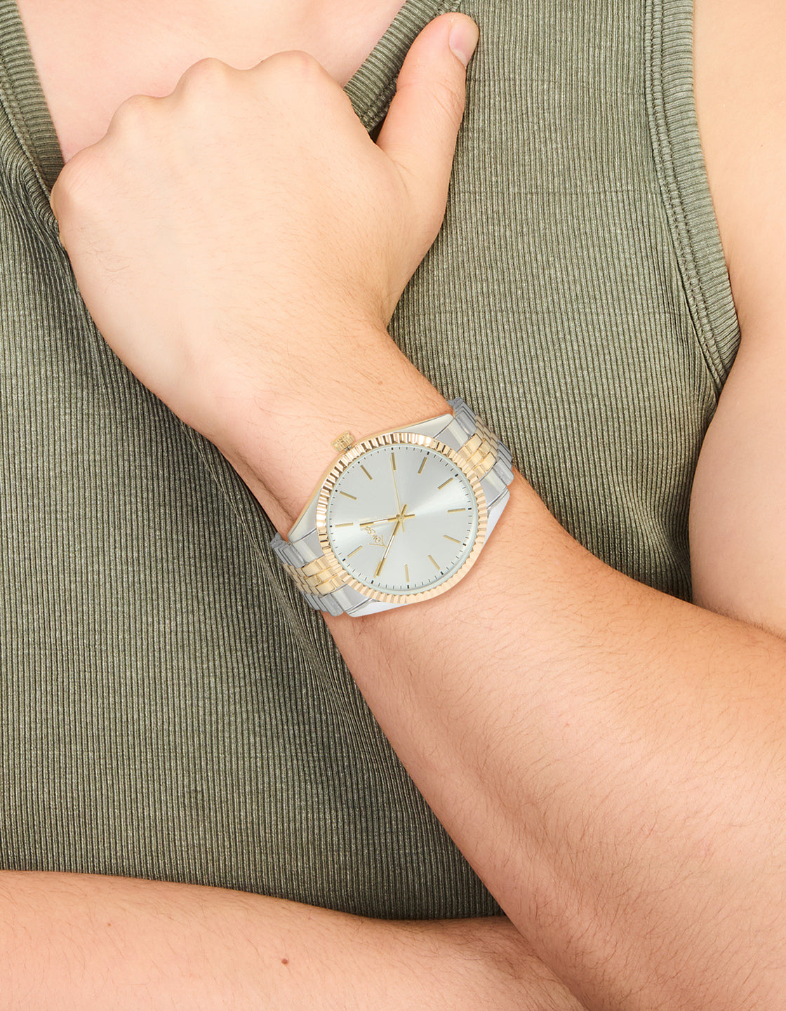 Featuring a men's mixed metal etched link classic watch with white dial, round shape, casual occasion, link band in multi-color, analog type, silver and gold tones on wrist view