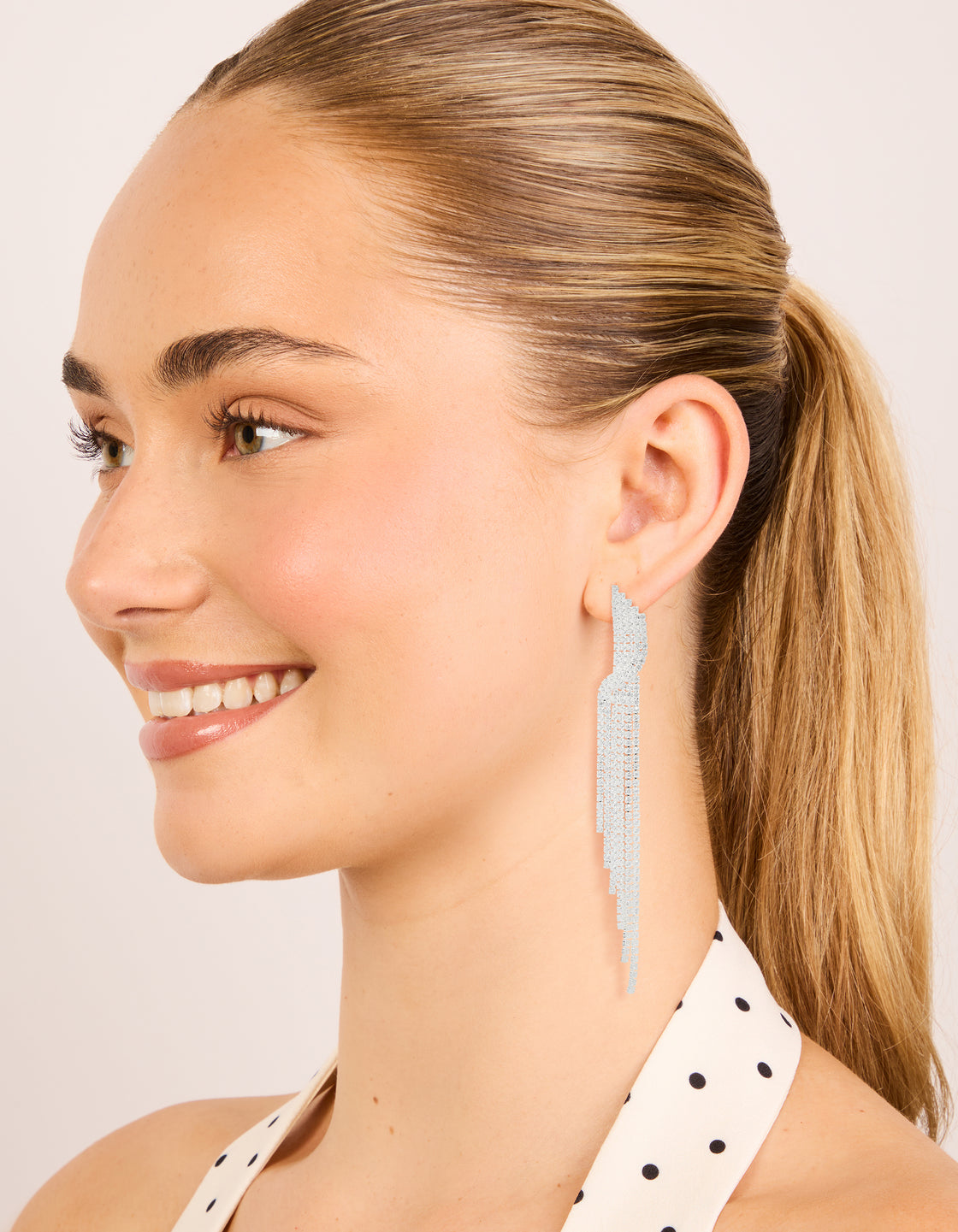 Featuring silver cubic zirconia cupchain drop earrings on model view