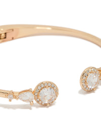Displaying a gold cubic zirconia hinged circle open front wrist cuff bracelet close up view - link has visual effect only