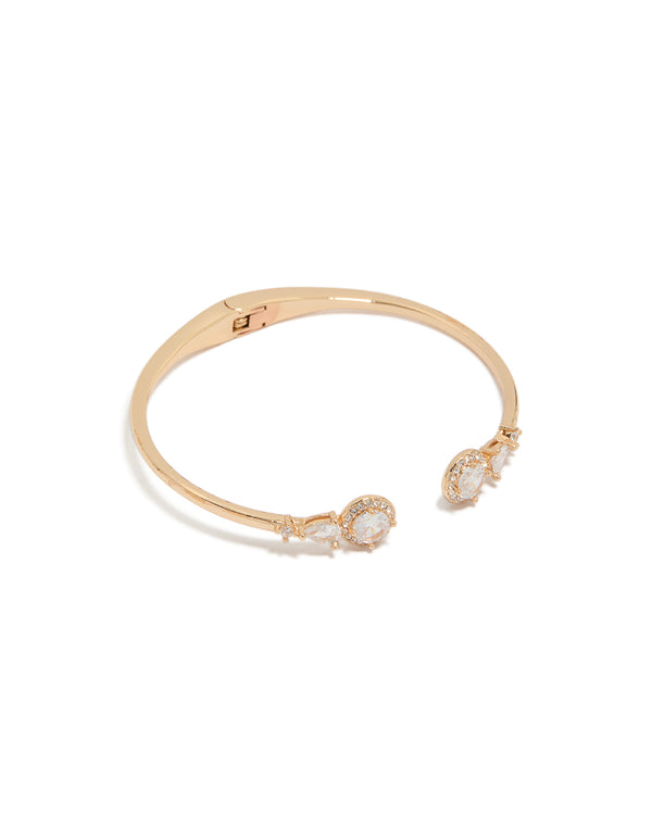 Showcasing a gold cubic zirconia hinged circle open front wrist cuff bracelet front view