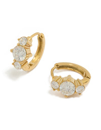 Showcasing dainty huggie earrings crafted from waterproof gold plated stainless steel with cubic zirconia trio stones in clear front view - link has visual effect only