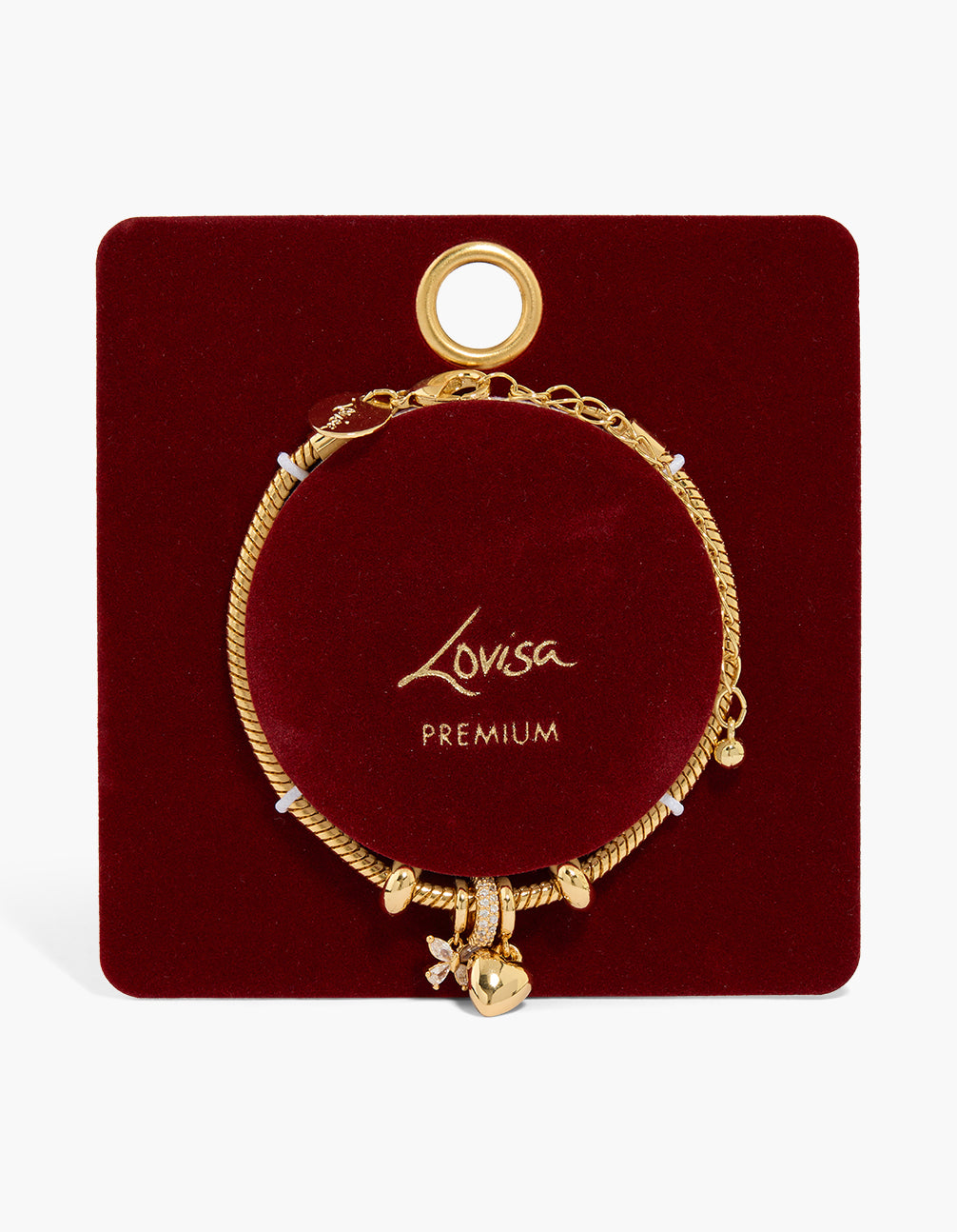 Delicate gold plated dainty charm bracelet featuring floral and heart details close up view
