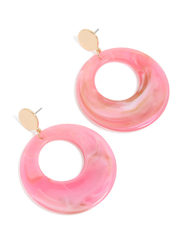 Showcasing chunky drop earrings with marble pattern in pink and gold circle design front view