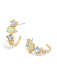 Crafted from gold plated metal, these blue and green cubic zirconia multi-shaped hoop earrings feature sky blue and pale green stones in a front view - link has visual effect only