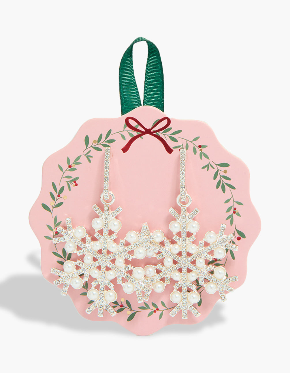 Showcasing statement snowflake earrings with pearl accents in silver front view