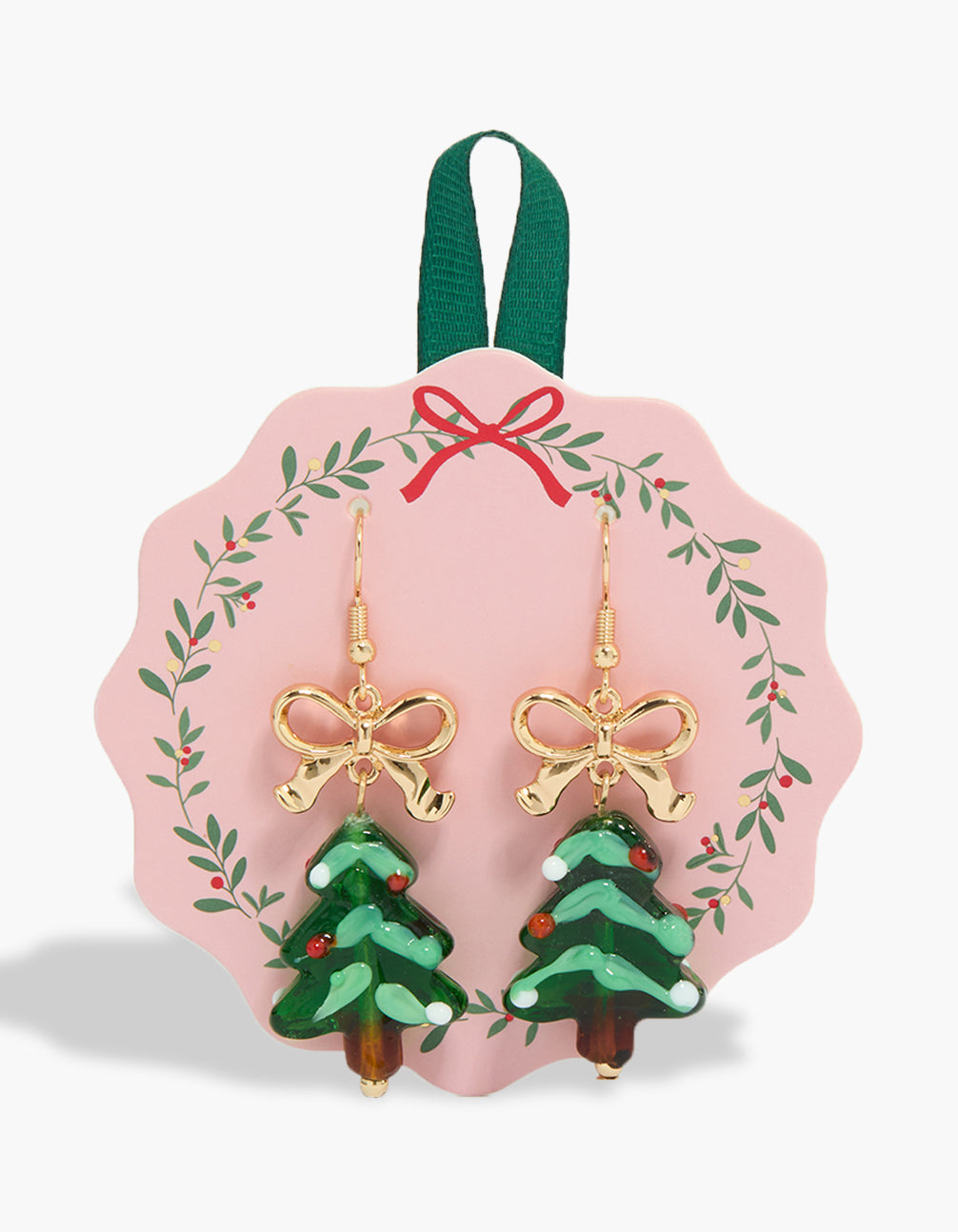 Showcasing chunky style earrings with bow and tree features in gold front view