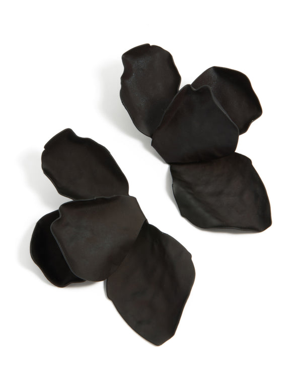 Showcasing statement drop earrings with floral half petal design in black coated metal front view