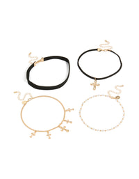 Showcasing a set of gold textured cross and plain black choker necklaces with beaded pearl charm details front view - link has visual effect only