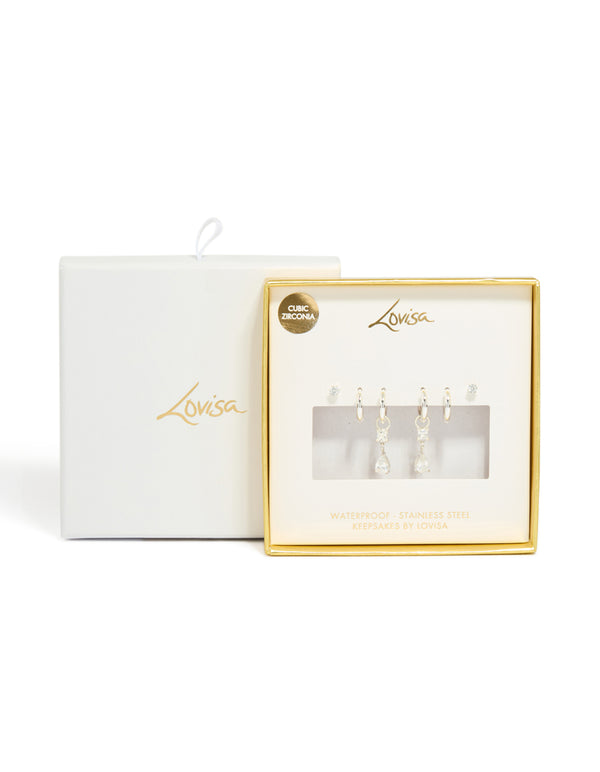 Designed with stainless steel cubic zirconia mixed drop hoop earrings 3-pack featuring crystal waterproof material and stud closure in silver and clear close up view