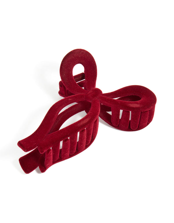 Showcasing a bow design dark red chunky velvet outline hair claw clip front view