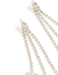 Stunning diamante triple tassel flower drop earrings with charm details in a chunky style close up view - link has visual effect only