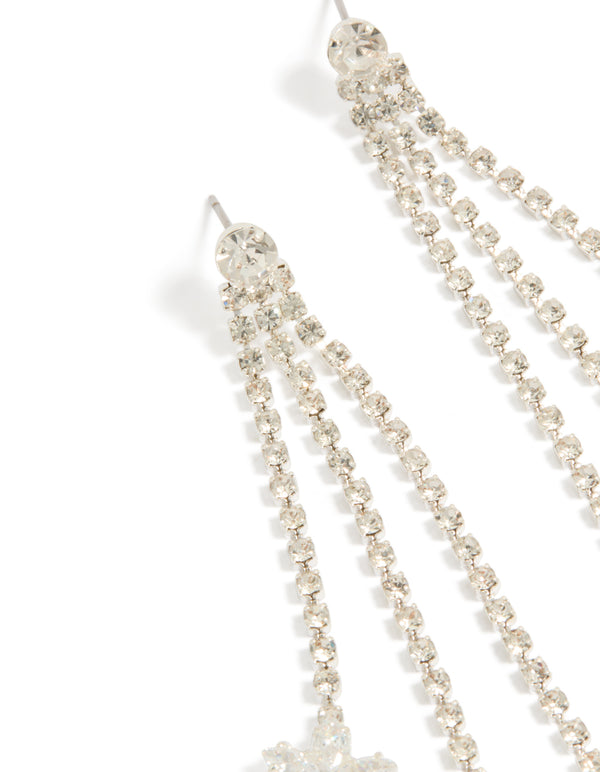 Stunning diamante triple tassel flower drop earrings with charm details in a chunky style close up view