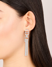 Featuring silver diamante round attached tassel drop earrings worn on ear view - link has visual effect only
